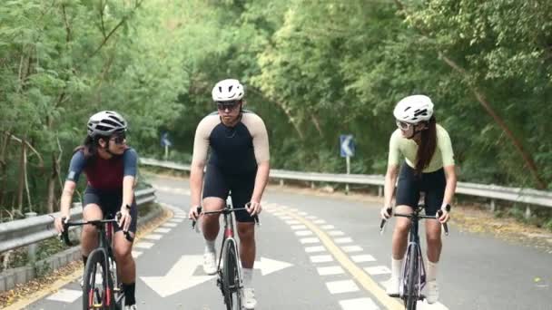 Young Asian Cyclists Riding Bicycles Rural Road — Stock Video