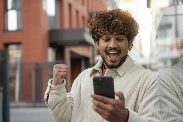 Excited Indian Man Using Smartphone Sport Betting Celebration Success Street — Stock Photo, Image