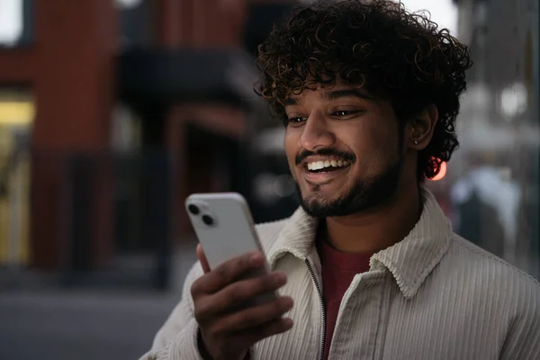 Night Portrait Stylish Smiling Indian Man Using Mobile Phone Reading — Stock Photo, Image