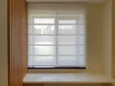 transparent roman blind on the window