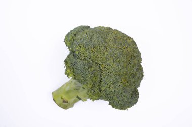 fresh broccoli on white background photographed from above