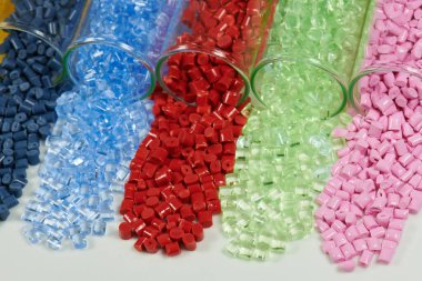 several colored plastic resins in test tubes in laboratory