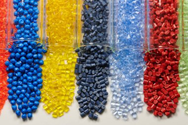 several colored plastic resins in test tubes in laboratory