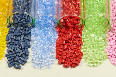 several colored plastic resins in test tubes in laboratory