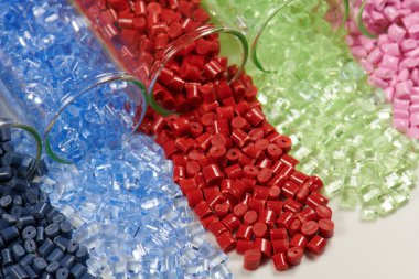 several colored plastic resins in test tubes in laboratory