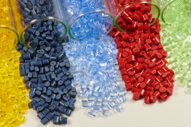 several colored plastic resins in test tubes in laboratory