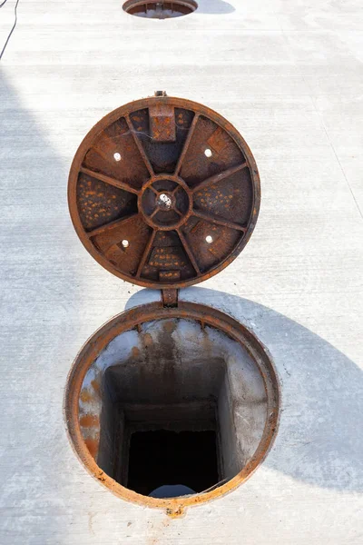 Concrete Floor Front Building Several Manhole Covers Cistern — стоковое фото