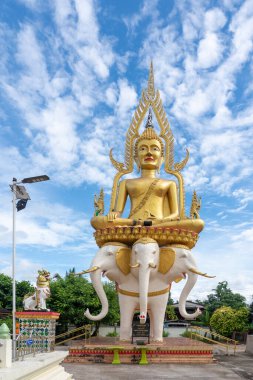 On a sunny day at the Mai Sot temple in northern Thailand is a big Buddha clipart