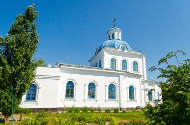 Old white church with a blue roof