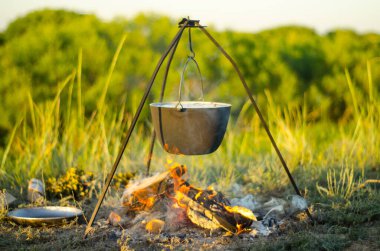Campfire dinner in summer