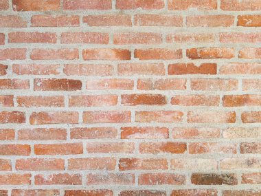 Kırsal bir kırmızı tuğla duvara yakın çekim, görünür havan topu, arka planlar, tasarım projeleri veya mimari ilham için mükemmel