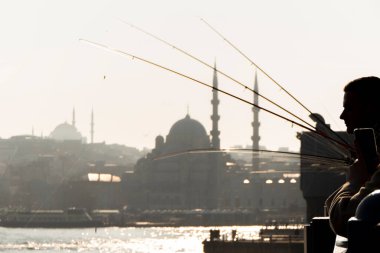 View from Galata Bridge, towards the New Mosque in Istanbul, Turkey