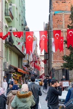 Crowded street with national turkish flags nex to Galata Tower, Istanbul, Turkey