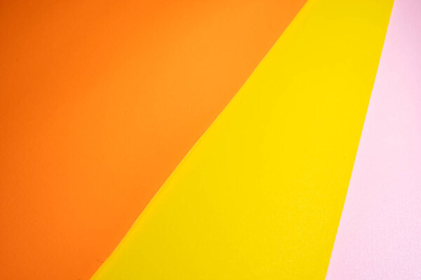Оранжевый, желтый и розовый цвет пастельной бумаги для фона