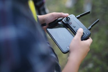 Young man are holding his drone controller