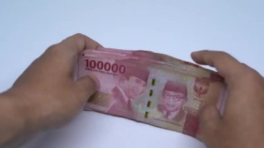 Endonezya Rupiah parası. İş ve ekonomi kavramı döngüye girebilir ve kusursuz bir altyapıya sahiptir. Endonezya para birimi.