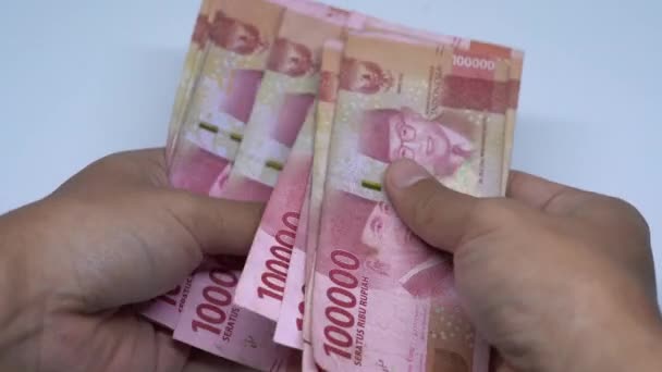 インドネシアのルピア マネー ビジネスと経済のコンセプトループ可能でシームレスなバックグラウンド インドネシアの通貨 — ストック動画