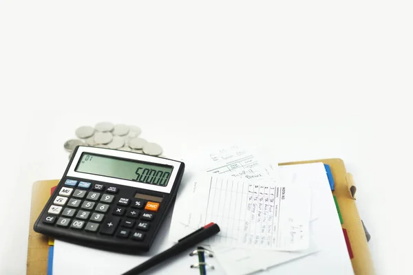 Business desk with calculator, notebook, and bills. Copy space website banner concept