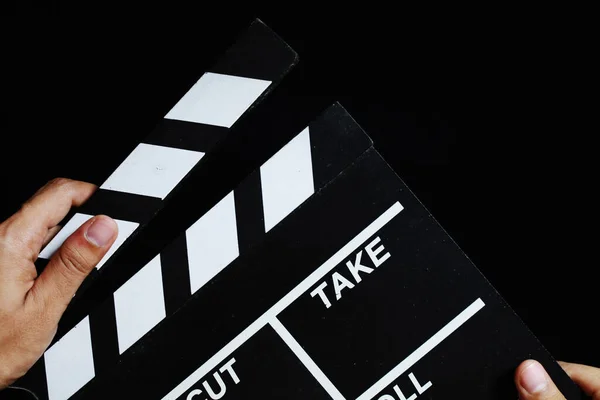 Movie production clapper board on black background