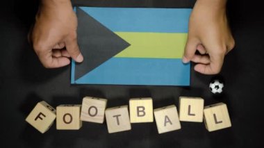 Futbol unvanlı Bahamalar bayrağı. futbol konsepti