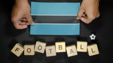 Futbol unvanlı Botswana bayrağı. futbol konsepti