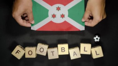 Futbol unvanlı Burundi bayrağı. futbol konsepti