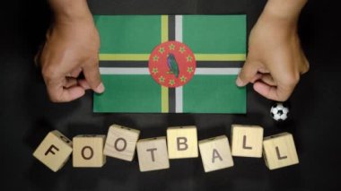 Futbol unvanlı Dominica bayrağı. futbol konsepti