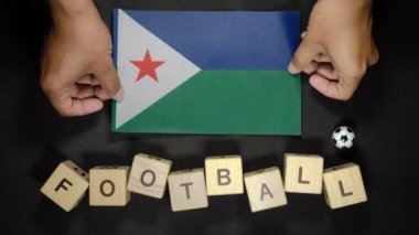 Futbol unvanlı Cibuti bayrağı. futbol konsepti