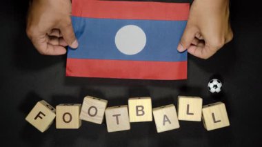 Futbol unvanlı Laos bayrağı. futbol konsepti
