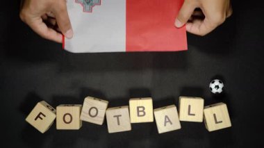 Futbol unvanlı Malta bayrağı. futbol konsepti