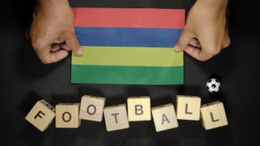 Futbol unvanlı Mauritius bayrağı. futbol konsepti