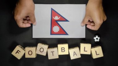 Futbol unvanlı Nepal bayrağı. futbol konsepti
