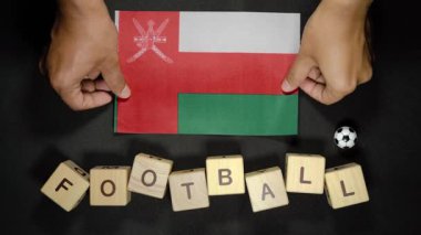 Futbol unvanlı Umman bayrağı. futbol konsepti