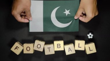 Futbol unvanlı Pakistan bayrağı. futbol konsepti
