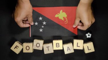 Futbol unvanlı Papua Yeni Gine bayrağı. futbol konsepti