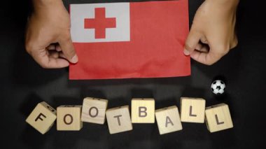 Futbol unvanlı Tonga bayrağı. futbol konsepti