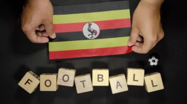 Futbol unvanlı Uganda bayrağı. futbol konsepti