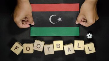Futbol unvanlı Libya bayrağı. futbol konsepti