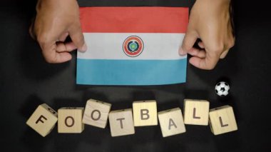 Futbol unvanlı Paraguay bayrağı. futbol konsepti