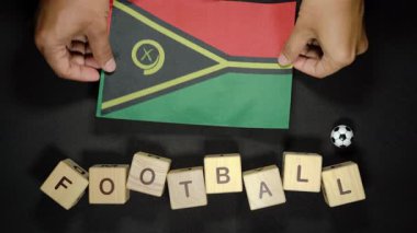Futbol unvanlı Vanuatu bayrağı. futbol konsepti
