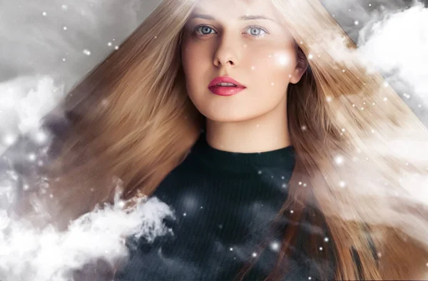 stock image Winter beauty, Christmas time and happy holidays, beautiful woman with long hairstyle and natural make-up behind frozen window, snowing snow design as xmas, New Year and holiday lifestyle portrait