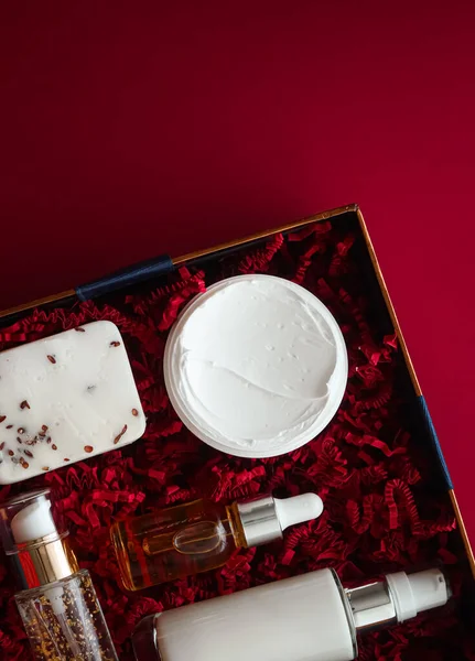 Beauty box subscription package and luxury skincare products, spa and cosmetic body care product flat lay on red background, wellness cosmetics as holiday gift, online shopping delivery, flatlay view