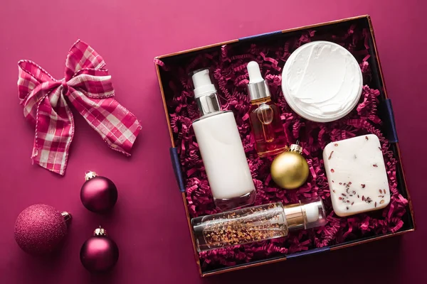 Christmas gift set, xmas holidays beauty box subscription package and luxury skincare products flatlay, cosmetic flat lay on pink background, cosmetics as holiday present or shopping delivery, top