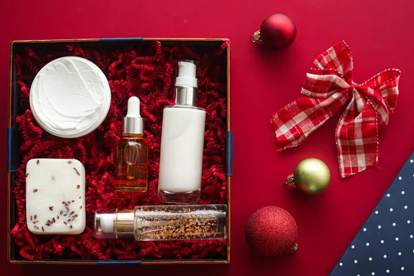 Christmas gift set, xmas holidays beauty box subscription package and luxury skincare products flatlay, cosmetic flat lay on red background, cosmetics as holiday present or shopping delivery, top view