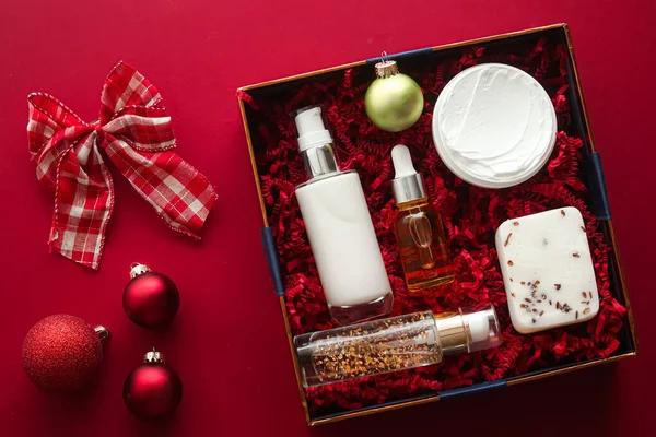 Christmas gift set, xmas holidays beauty box subscription package and luxury skincare products flatlay, cosmetic flat lay on red background, cosmetics as holiday present or shopping delivery, top view