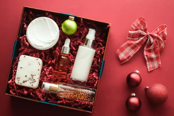 Christmas gift set, xmas holidays beauty box subscription package and luxury skincare products flatlay, cosmetic flat lay on coral background, cosmetics as holiday present or shopping delivery, top