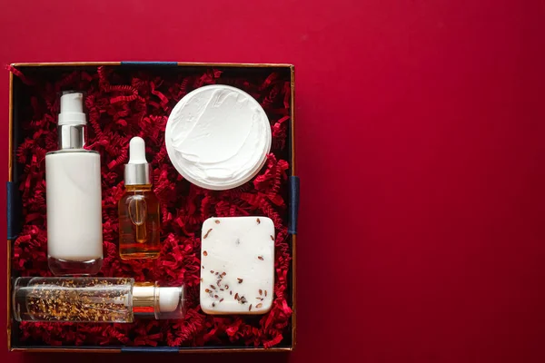 Beauty box subscription package and luxury skincare products, spa and cosmetic body care product flat lay on red background, wellness cosmetics as holiday gift, online shopping delivery, flatlay view