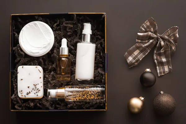 Christmas gift set, xmas holidays beauty box subscription package and luxury skincare products flatlay, cosmetic flat lay on dark background, cosmetics as holiday present or shopping delivery, top