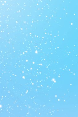 Kış tatilleri ve kış arkaplanı, mavi zemine düşen beyaz kar taneleri bokeh ve kar parçacıkları Noel ve karlı bayram tasarımı için soyut kar sahneleri. Yüksek kalite