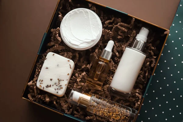 Beauty box subscription package and luxury skincare products, spa and cosmetic body care product flat lay on beige background, wellness cosmetics as holiday gift, online shopping delivery, flatlay